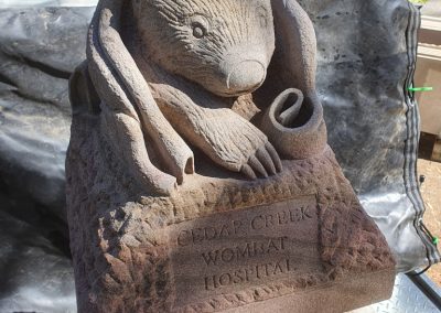 carved sandstone wombat